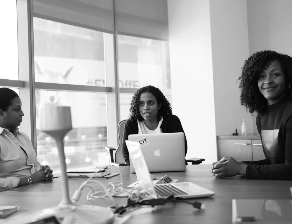 3 women attending a business meeting.